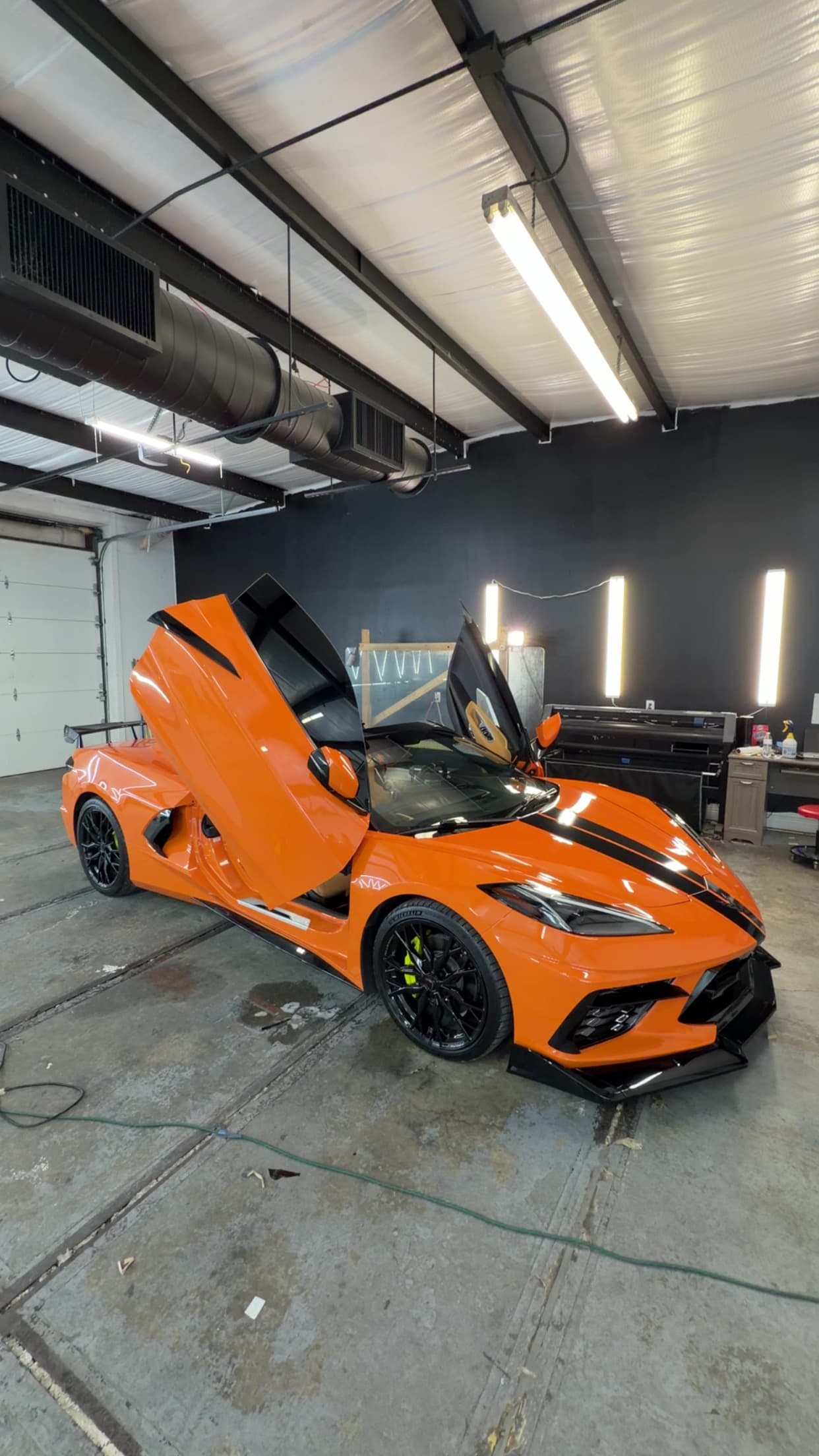 Orange C8 Corvette scissor doors