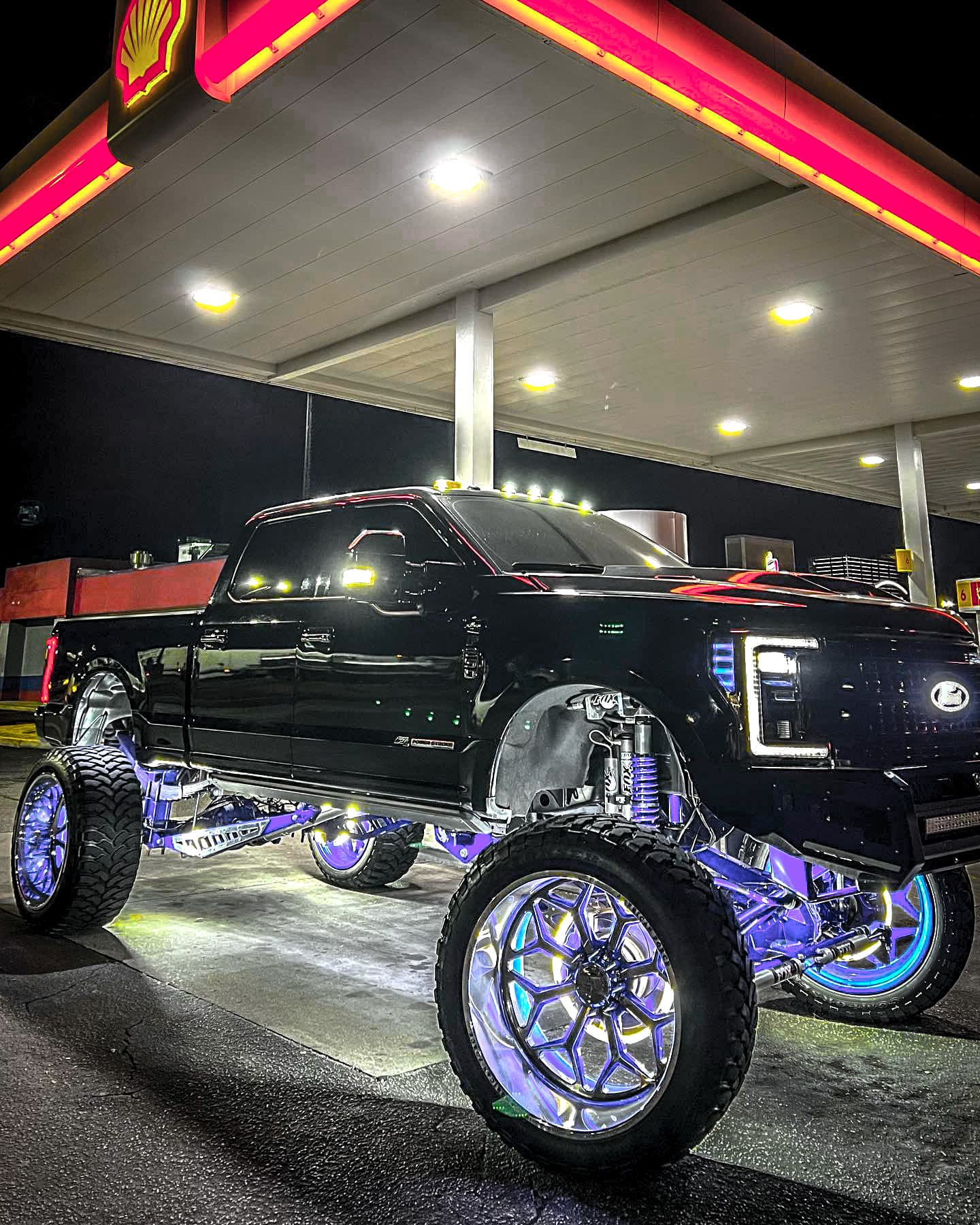 Lifted Ford Super Duty with LED underglow