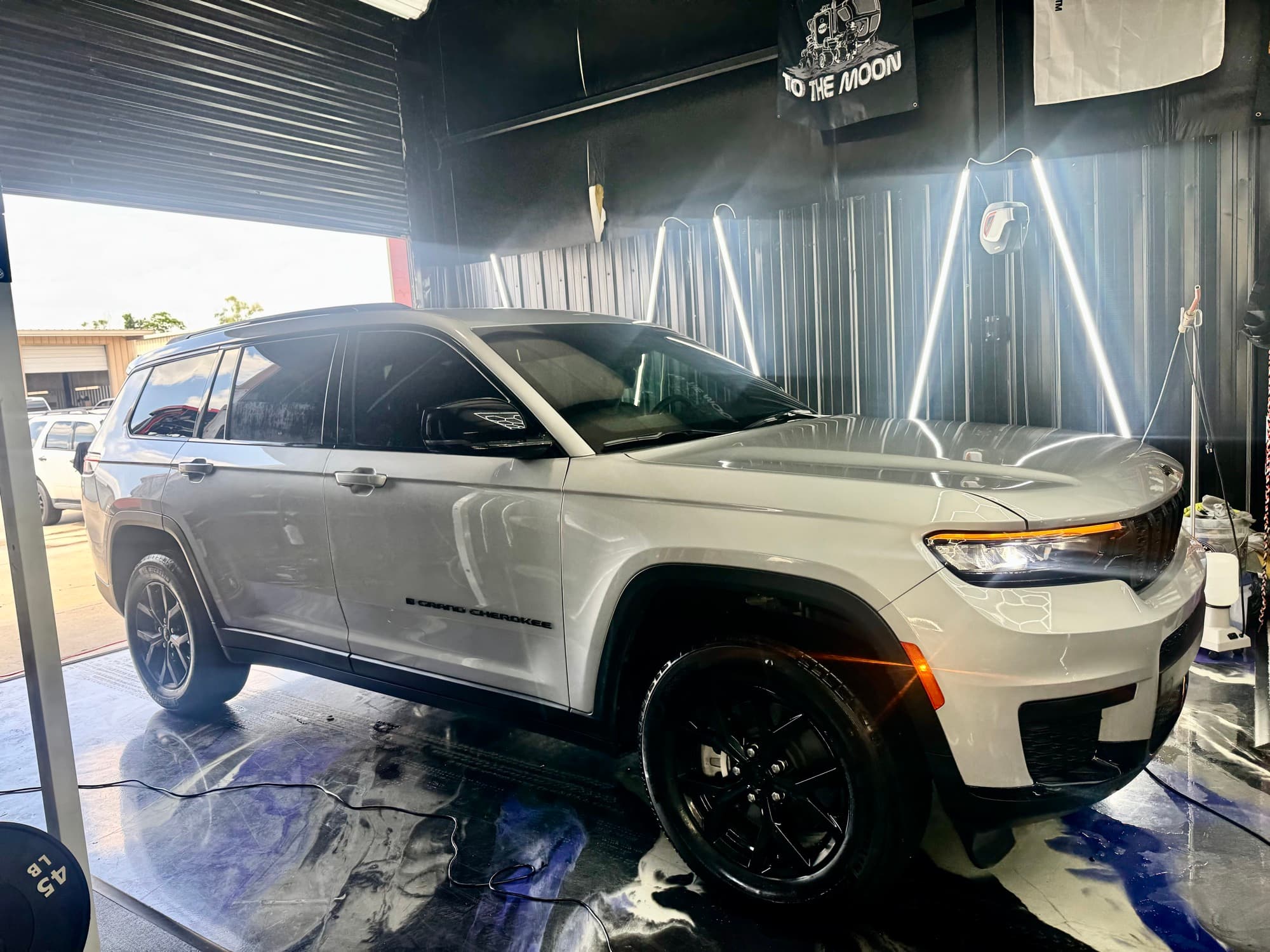 Jeep Grand Cherokee in shop with hexagon lighting
